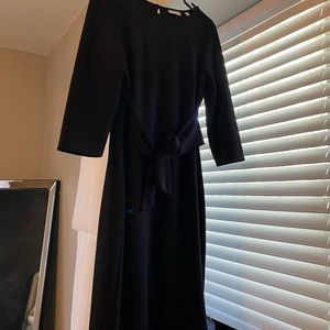 Black midi dress with tie in front.
